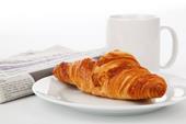 Answer breakfast, croissant, daily newspaper